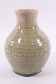 A Moorcroft vase with celadon glaze, impressed factory marks,