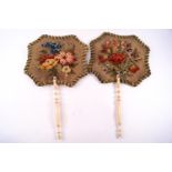 A pair of Victorian face fans with wool work banners and carved ivory handles,