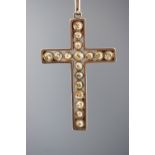 A yellow and white metal cross pendant set with graduated old cut diamonds....