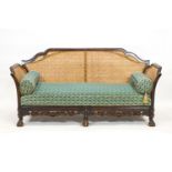 A sofa with mahogany frame carved and shaped in the William and Mary style