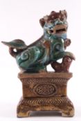 A Chinese earthenware figure of a Buddhist Temple Lion,