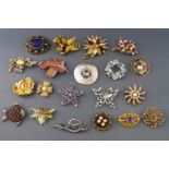 A collection Twenty costume brooches having enamel finish or paste stones.