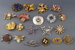 A collection Twenty costume brooches having enamel finish or paste stones.