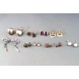 A collection of ten pairs of earrings of various styles