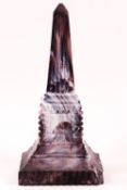 A 19th century purple and opaque white Slag glass obelisk,