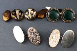 A collection of three pairs of cufflinks consisting of an oval engraved chain link pair....