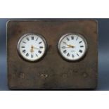 A rectangular silver fronted dual time zone strut framed desk clock with quartz movements,