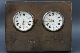 A rectangular silver fronted dual time zone strut framed desk clock with quartz movements,