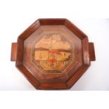 An Art Deco drinks tray in various hardwoods, of octagonal form,