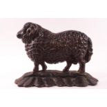 A cast iron door stop in the form of a ram,