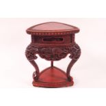 A cinnabar tripod stand carved with dragons,