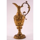 A 19th century Ormolu ewer with scroll handle and flared foot,