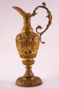 A 19th century Ormolu ewer with scroll handle and flared foot,