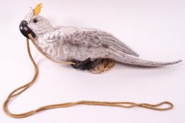 A Continental porcelain figure of a Cockatoo climbing a rope, unmarked,