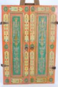 A pair of Syrian painted window shutters, each with two hinges and a ring handle,