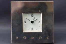 A square silver fronted framed desk clock, with quartz movement, Sheffield Jubilee marks,