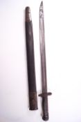 A 1907 Wilkinson steel bayonet in original scabbard, the blade stamped with a crown, 1907,