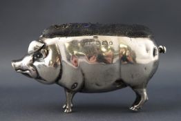 A pin cushion, in the form of a pig, London 1901,