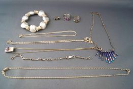 A selection of jewellery to include five necklace, a hallmarked sterling silver sapphire ring...