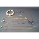 A selection of jewellery to include five necklace, a hallmarked sterling silver sapphire ring...