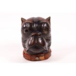 A carved Black Forest style inkwell in the form of a pug's head,