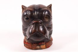 A carved Black Forest style inkwell in the form of a pug's head,