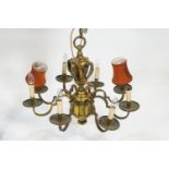 An early 20th century brass eight branch chandelier,
