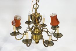 An early 20th century brass eight branch chandelier,