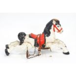 A 1950's/60's child's pressed metal painted toy horse, on four springs to be suspended on chains,