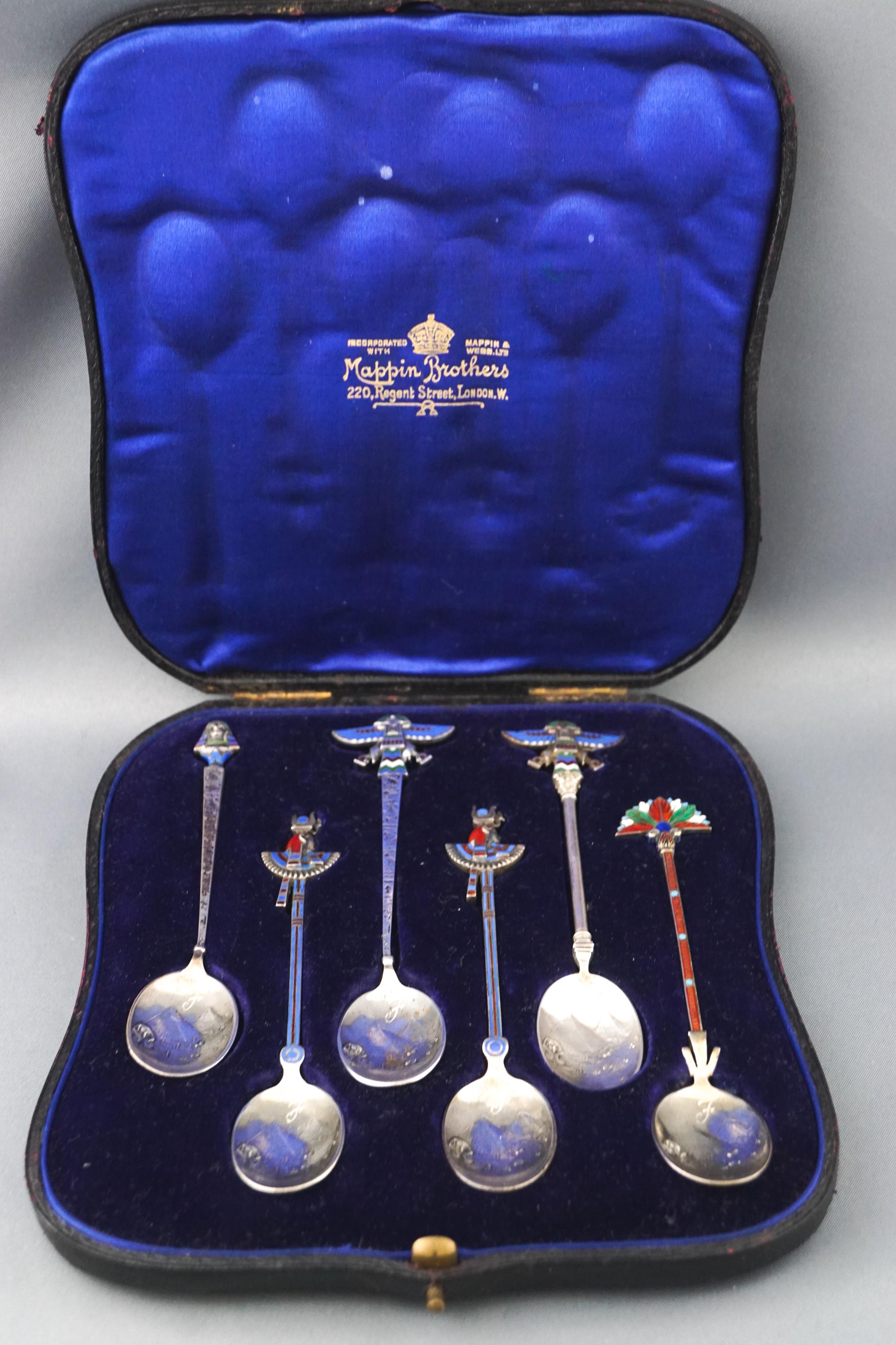 A cased set of six white metal Egyptian Revival enamelled tea spoons,