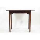 A mahogany swivel top tea table by Warings & Gillow Ltd and stamped to the drawer accordingly,