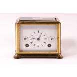 A brass cased carriage clock of unusual horizontal rectangular form,