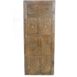 A pair of 19th century oak panels, each enclosing seven carved panels,