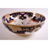 A 19th century porcelain punch bowl, decorated in the Imari palette picked out in gilt,