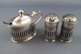 A silver three piece cruet set in the 18th century bright cut oval style,