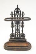 A cast iron umbrella stand with an anthemion back plate,