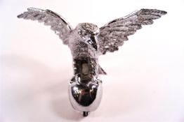 A Desom (?) chromed cast metal car mascot in the form of an eagle with outstretched wings,