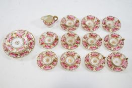 A porcelain tea service painted with roses with gilt leaves, retailed by T Goode & Co,