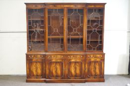 A George III reproduction mahogany breakfront bookcase,