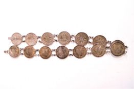 A Chinese belt composed of fourteen 1899 one dollar coins with a figure of Britannia,