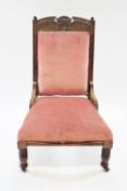 A Victorian mahogany chair with carved show frame on turned legs, 98cm high, 63cm wide,
