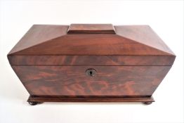 An early 19th century mahogany sarcophagus tea caddy,