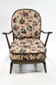An Ercol stick back tub chair of traditional form, 77cm high, 73cm wide,