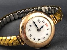 A yellow metal wristwatch. Mechanical movement, case reference: 1318926.