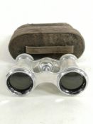 A pair of mother of pearls opera glasses in original carrying case