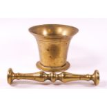 A brass pestle and mortar, or traditional form,
