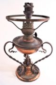 A copper Arts and Crafts style lamp,