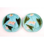 A pair of 19th century majolica turquoise glazed plates decorated with waterlillies