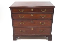 An 18th century chest of four long drawers, of plain rectangular form,