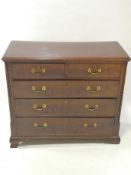 A George III mahogany chest of two short and three long drawers,